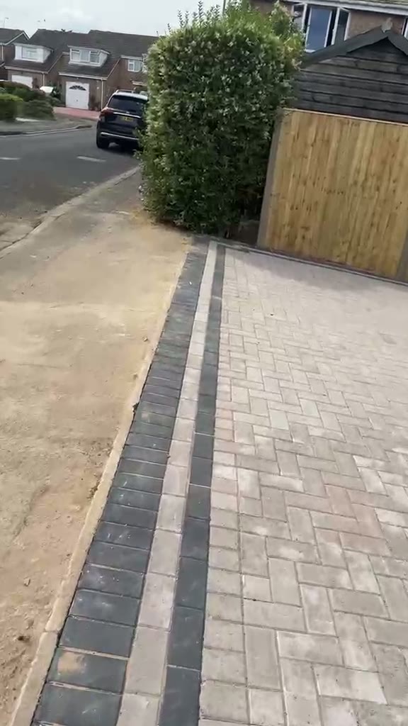 Walkthrough of a block paved Gloucester driveway with a charcoal drainage channel and double soldier course
