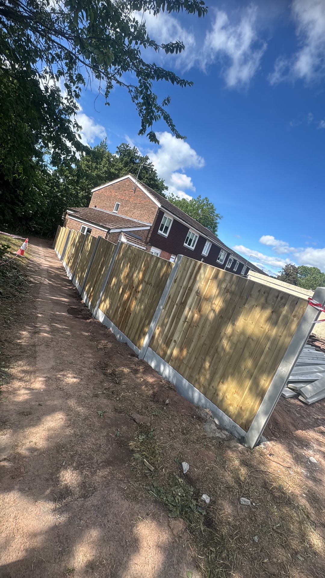 Closeboard fence panels between concrete posts with gravel boards along a Gloucester boundary