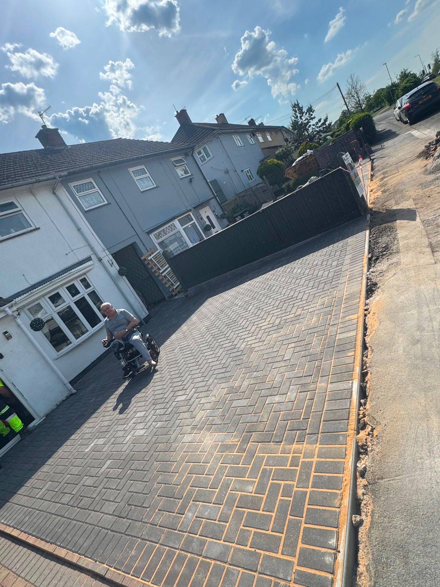 Wide grey herringbone block paved driveway with level step-free access in Gloucester